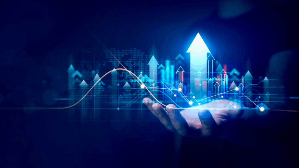 A hand holds digital graphics of rising arrows and financial charts, symbolizing growth, progress, and success in business or financial markets on a dark blue background.