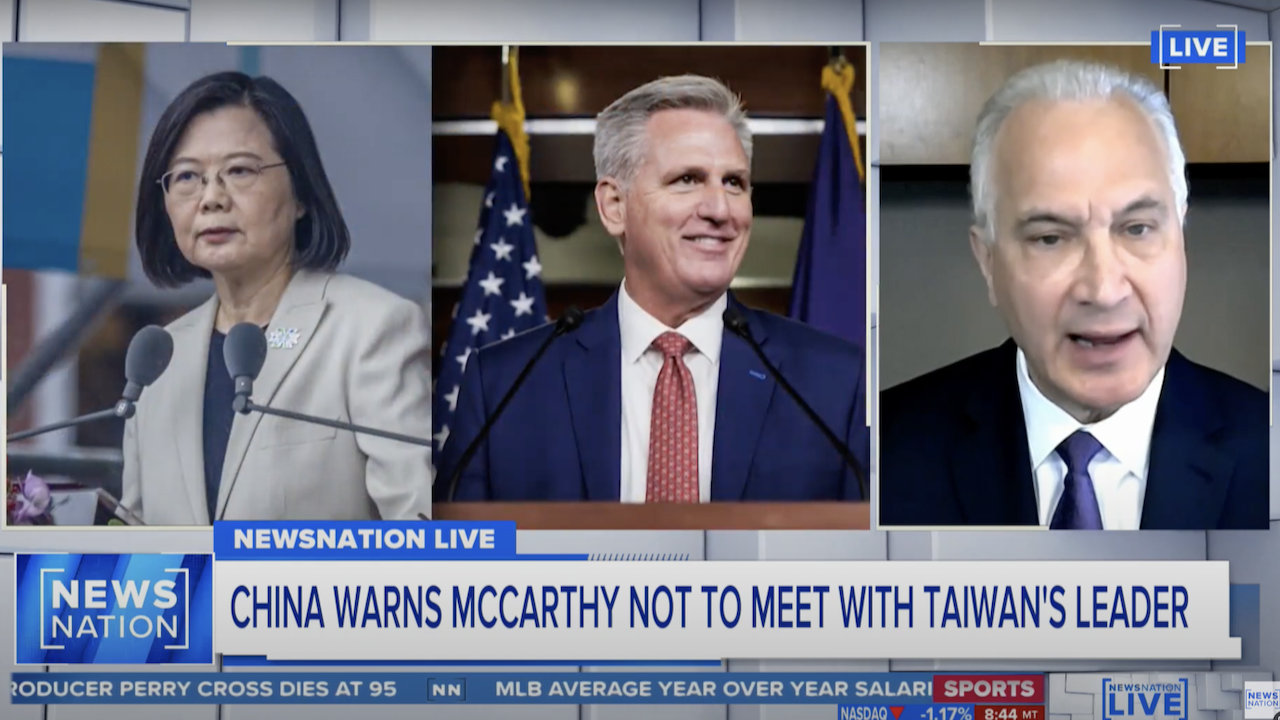 A news broadcast shows photos of Taiwans president, U.S. House Speaker Kevin McCarthy, and a news commentator, with a headline reading, China Warns McCarthy Not to Meet with Taiwans Leader.