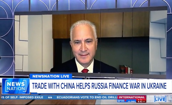 A man in a suit appears on a NEWSNATION LIVE broadcast, with the headline Trade with China helps Russia finance war in Ukraine displayed at the bottom of the screen.