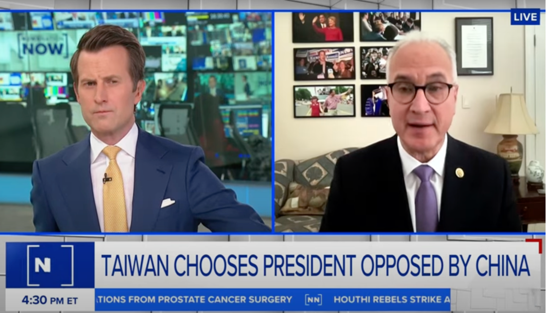 Two news anchors discuss Taiwan’s presidential election on a split-screen broadcast. The left anchor sits in a studio; the right is in an office with framed photos. The headline reads, “Taiwan chooses president opposed by China.”.