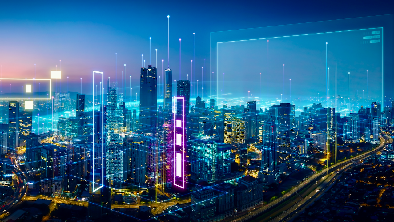 A futuristic city skyline at dusk, with tall buildings illuminated and digital neon lines and rectangles superimposed, symbolizing advanced technology, connectivity, and smart city infrastructure.